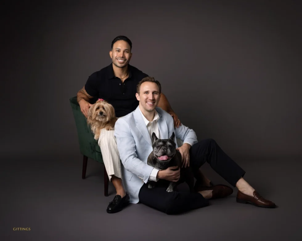 ©Gittings_studio_pet_portrait_couple_with_dogs_dark_background